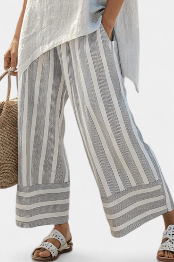 Daisy-set met Asymmetrische Blouse en Gestreepte Broek voor een Moderne en Elegante Stijl